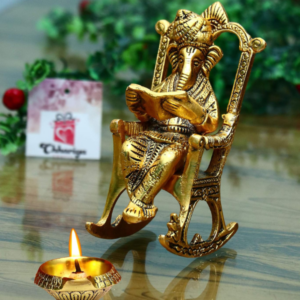 CHHARIYA CRAFTS Metal Lord Ganesh Reading Ramayana Statue Ganpati Sitting on Chair with Kuber Diya Idol for Home Office and Gifts Decor Corporate Gifts Decorative Showpiece - 14 cm (Metal, Gold)